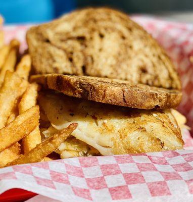 House specialty "Grouper Ruben" with fries has a YUGE size piece of grilled perfectly cooked local fresh grouper :)...