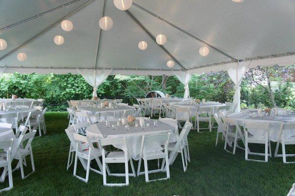 Planning A Wedding? White Frame Tent With White Padded Garden Chairs