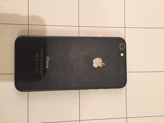 A custom black matte and gold iPhone 6