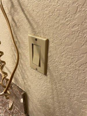 Bathroom light switch shorted when turned on. Walls nasty and discolored in various areas.