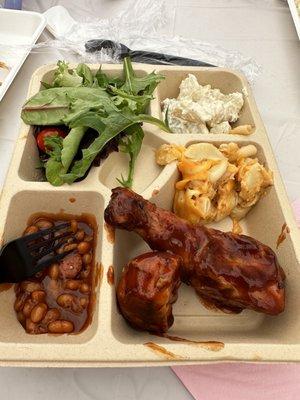 Bbq chicken, beans, Mac and cheese, potato salad, and dinner salad.