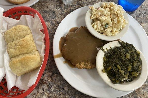 Lunch entree with 2 sides. This is the chuckwagon with gravy, macaroni salad (yummy!) and turnip greens. Cones with the 3 rolls in photo.