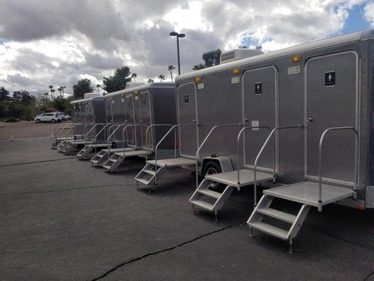 Three 3-stall Luxury Restroom Trailers for outdoor event.