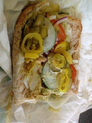 6 inch grilled chicken with Swiss cheese heated with sliced cucumbers pickles onions tomatoes sliced banana peppers mustard on 9 grain wheat