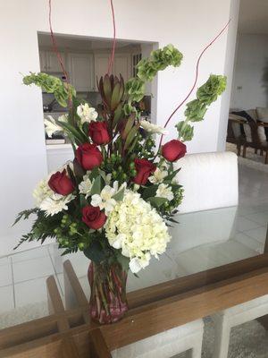 Amazing  modern arrangement and very fresh flowers delivered on time.  Will definitely use again and again!!!!