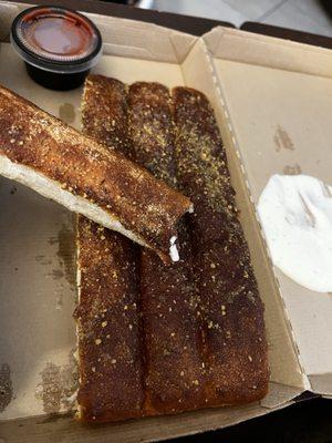 BURNT breadsticks!! I was so mad. The pizza Marinara wasn't good.  I was so upset. What has happened to their service....