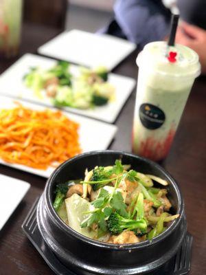 Clay pot with tofu, garlic noodles, steamed veggies, strawberry green tea with coconut milk and boba