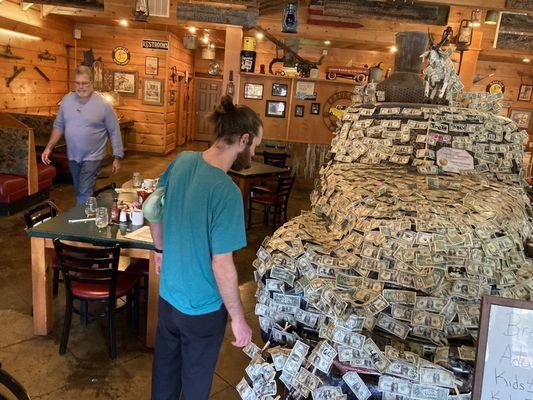 I was told tradition started with signing the truck. room, someone started it with a dollar bill.