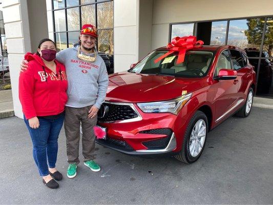 My fiancé & I with our new 2021 Acura RDX at Niello Acura in Roseville