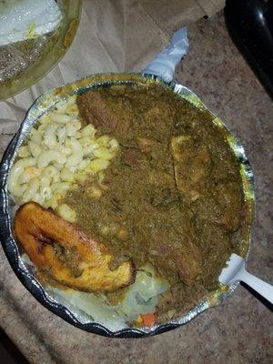 Large curry goat with macaroni salad, vegetable rice, cabbage and plantain. Delish!