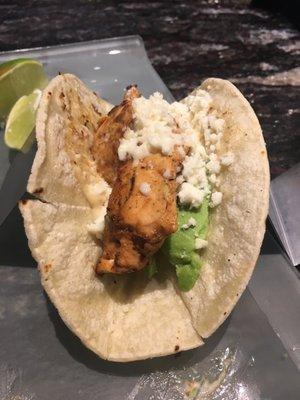 Salmon tacos with chipotle sauce, avocado and cheese. Delicious! Bring the fire!