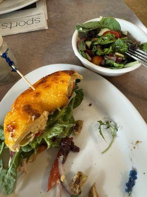 Mediterranean sando, add bacon, on a cheddar bagel. With side salad.