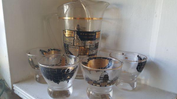 Used glassware set with pitcher with US capital and stated imprinted in gold/black.