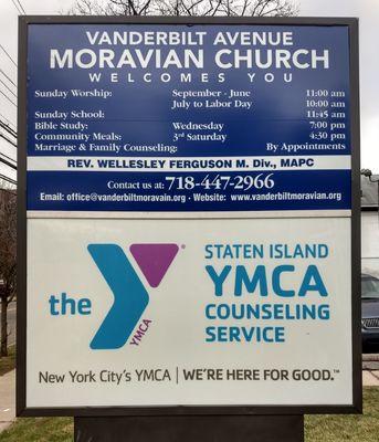 New Vanderbilt Avenue Moravian Church and S.I. YMCA sign at sidewalk