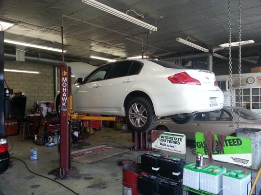 My car getting his oil "refreshed".  Full sythentic and premium filter that I brought.