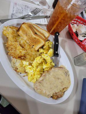 Tenderloin with gravy, toast, scrambled eggs, hash browns ,  unsweetened tea.