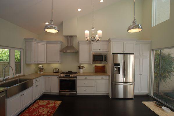 Complete kitchen  remodel with raised panel white cabinets, vaulted ceiling and added windows for light.