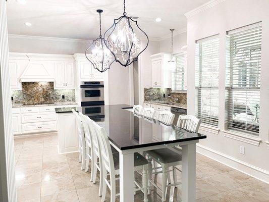 After: Full paint of cabinetry, moved pendants over new custom island