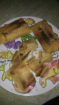 Burned cheese tamales.. Not the best tasting.. There goes my 10 bucks.. Bought 1/2 a dozen