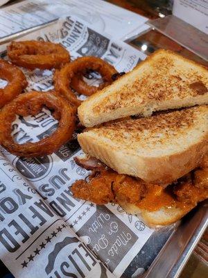 Pimento cheese chicken sandwich with onion rings