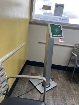 Check-in kiosk across the room. No signs or indication that patients have to check in here.