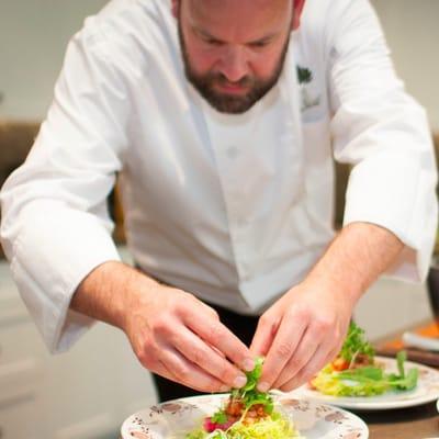 The Chef building salads.