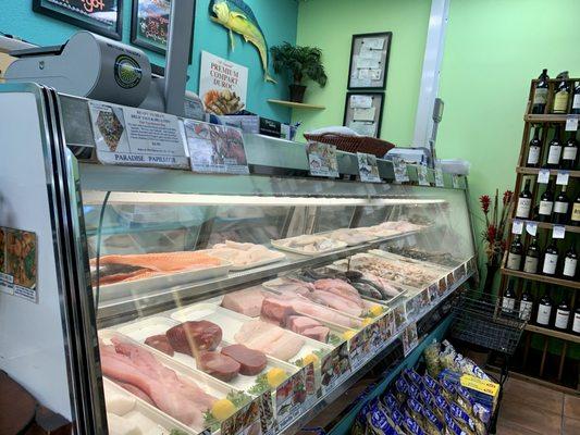 Raw seafood case inside the market.