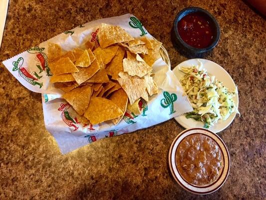 Yummy chips, beans, salsa, and spicy cabbage!