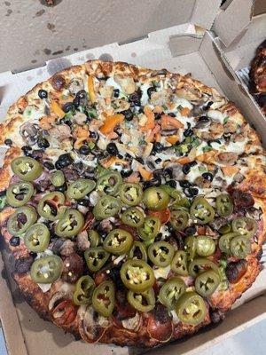 Half The Everest Pizza with jalapeños half robbers roost