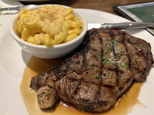 12 oz ribeye medium rare juicy and delicious! MAC and cheese served hot and creamy!