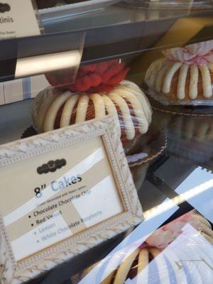 This shelf holds the largest size.  All cakes are in a refrigerated case.