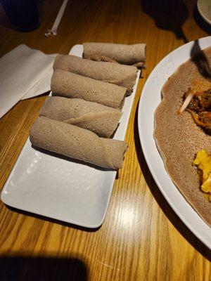 Three sponge bread roll ups per person