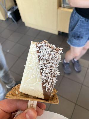 Half eaten delicious coconut popsicle