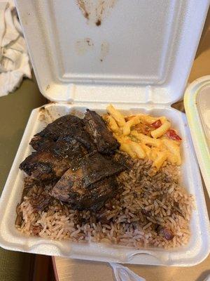 Jerk chicken, rice & peas and macaroni & cheese.