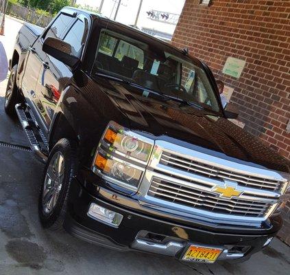 Look at the shine on this big black pick up truck