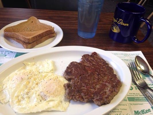 Hamburger steak, eggs, toast and coffee.  Ordered without home fries