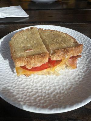 Cheese, tomato and bacon sandwich