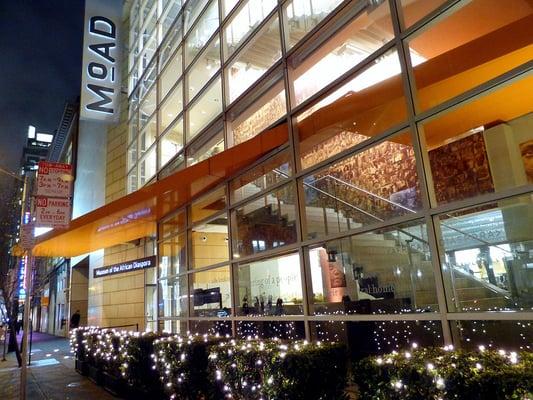 MoAD facade with a royal orange carpet and topiary