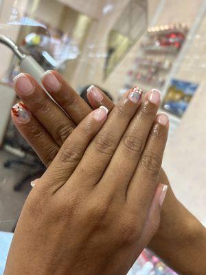 French tip with design done by Tina. She is patient and does such a wonderful job of trying to fulfill of what you ask for:)