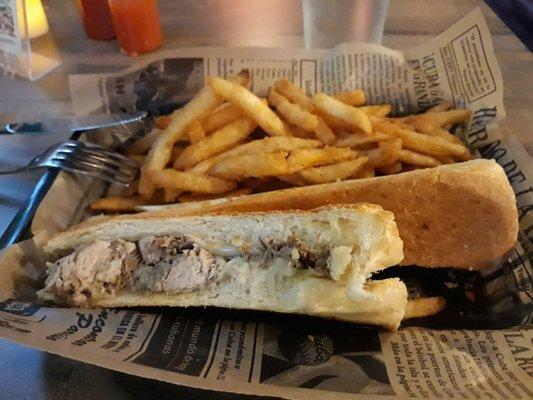 Pork sandwich with a side of fries. The Cuban bread is nice and crunchy!