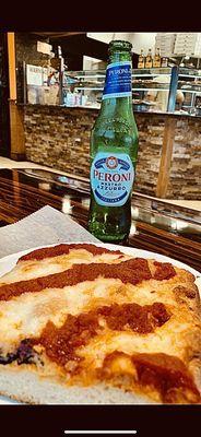 Peroni with a nice Sicilian slice. Perfect lunch to get you through the day! I recommend this.