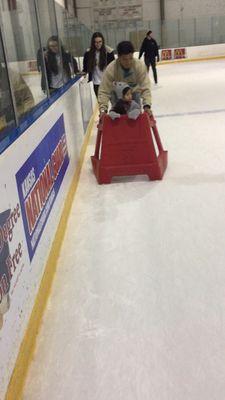 This red shield can be rented for $5 each. It is to help your toddler learn how to skate. Great for first timers.