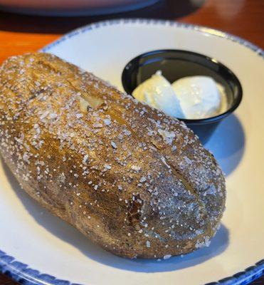 Baked potato with butter and sour cream