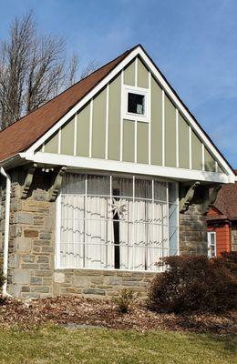 After. Custom window with classic cross hatch pattern, custom green color, and they even painted the wooden supports to match!