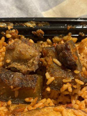 Jollof rice and beef (fat chunks).