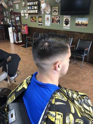 Medium skin fade with a combover by Jess