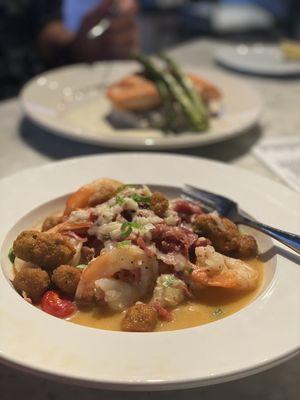 Shrimp and Grits (foreground) and Salmon with mushroom risotto (background)