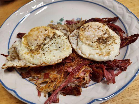 Corned beef hash (ordered extra crispy) with 2 eggs over easy. Also comes with a side of house made toast (not pictured)