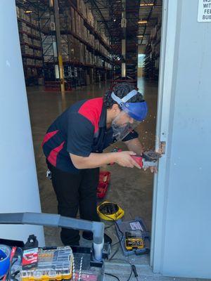 FlyLock Orange County access control specialist preparing a door frame for an electric strike installation