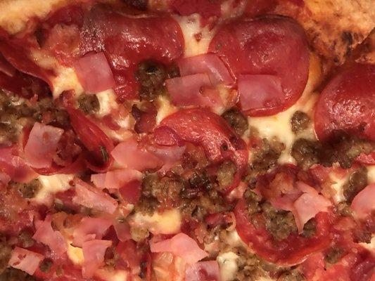 Amazing Meat Pizza with a perfect thin crust! Loaded with tasty ham,sausage and pepperoni!